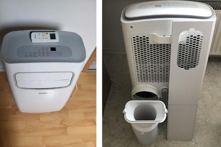 Die Comfee PAC 12000 mobilen Klimaanlage  steht auf dem Boden und wird von vorne und mit geöffneter Rückseite gezeigt, wo der Luftfilter vor dem Gerät liegt.